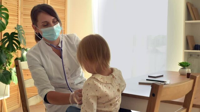 Cute little girl at the hospital at the doctor's appointment. 