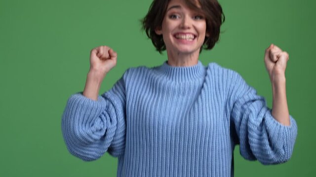 Ecstatic lady fist up win yes triumph isolated shine color background