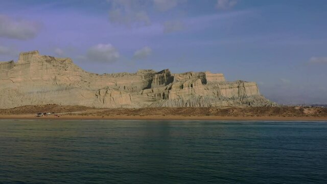 Aerial Over Arabian Sea With Rugged Mountains Of Hingol National Park In Background. Dolly Forward