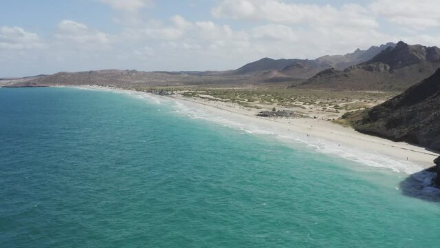 Drone flies over the coast of Tecolote Beach, Baja Mexico.