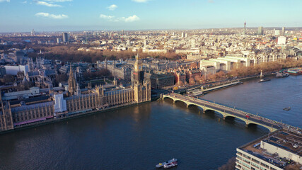 Fototapeta na wymiar Aerial drone photo of iconic City of Westminster with houses of Parliament, Big Ben and Westminster Abbey in front of river Thames, London, United Kingdom