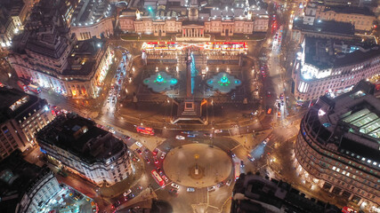 Aerial drone night shot of illuminated Trafalgar square as seen at Christmas time, Westminster, London, United Kingdom - obrazy, fototapety, plakaty