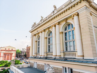 View from the drone Odessa National Academic Opera and Ballet Theater. One of the largest theaters in Ukraine. People are resting near the fountain of the Odessa Opera and Ballet Theater. Odessa drone