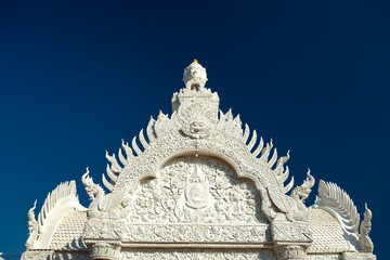 Fototapeta na wymiar Wat Ming Muang white temple in Nan, Thailand
