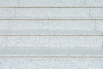 Grey detail pattern of the stairs on the entrance of a building.