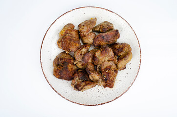 Cooked chicken liver on plate. Liver dishes. Studio Photo