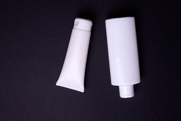 hand cream packaging on black background