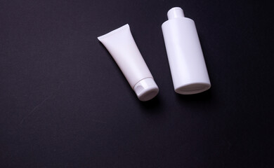 hand cream packaging on black background