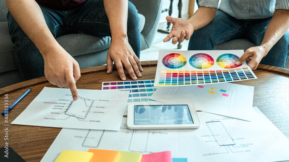 Poster team of creative web/graphic designer planning, drawing website ux app for mobile phone application 
