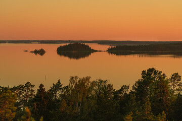 Fototapeta na wymiar Early, summer dawn, over the sea. Nature of Scandinavia. Islands in the sea. Finland.