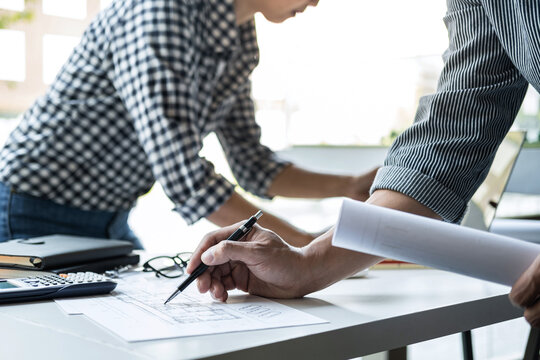 Construction and structure concept of Engineer or architect meeting for project working with partner and engineering tools on model building and blueprint in working site, contract for both companies