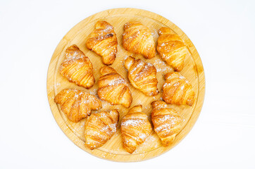 Delicious golden crispy freshly baked croissants. Studio Photo