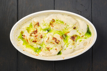Top view of pork dumplings with mushroom sauce baked in oven