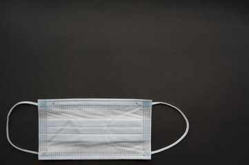 Medical mask isolated on background. Close-up of Coronavirus or COVID-19 protective face mask....