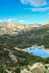 Fototapeta na wymiar The swamp of Guadalest village surrounded by vegetation and mountains
