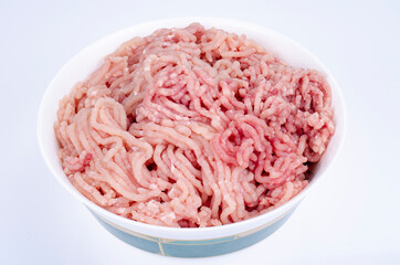Minced fresh chicken meat on white background. Studio Photo