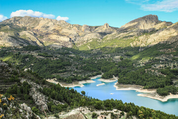 Fototapeta na wymiar The swamp of Guadalest village surrounded by vegetation and mountains