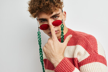 man in striped sweater stylish glasses fashion light background