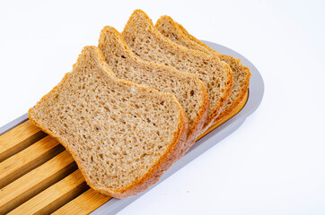 Sliced square shaped protein bread, healthy food. Studio Photo