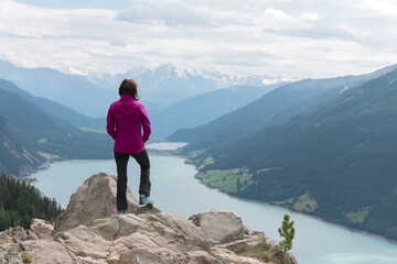 sporty woman distance vantage point lake tyrol