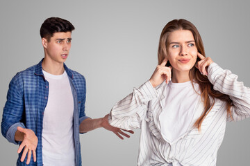 Quarrel and showdown. Sad woman covers her ears with fingers, upset man expresses negative emotions