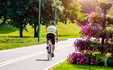 Cyclist ride on the bike path in the city Park
