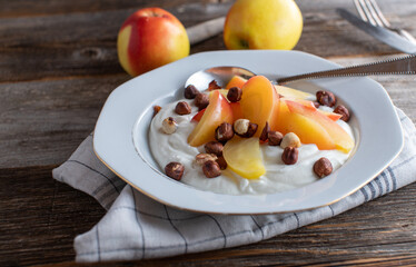 Grain free breakfast bowl with icelandic skyr, sauteed apples and roasted hazelnuts