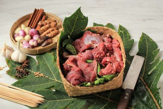 Meat on Bamboo Wooven Box or Besek, with Papaya Leaf Making Beef Tender