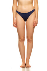Fototapeta premium front view of beautiful women legs and dark blue panties