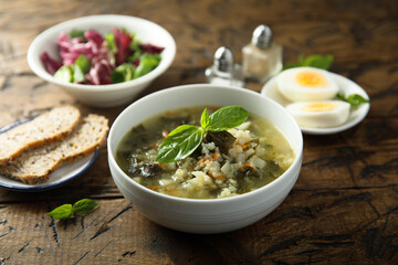 Traditional homemade green soup with hard boiled eggs