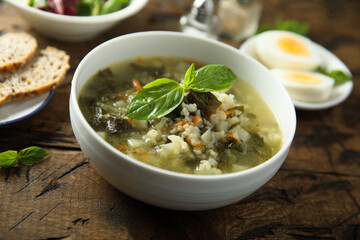 Traditional homemade green soup with hard boiled eggs