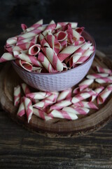 Colorful Italian pasta background. Various colors of  tie farfalle pasta. Selective focus. noodles