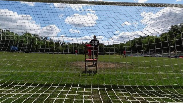 Funny Football: Goalkeeper Playing Sitting on the Chair