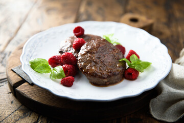 Homemade meat chops with raspberry and mint