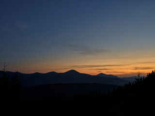 summer sunset at charphatian mountains with view on Chornogora