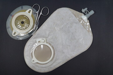 Urostomy and  nephrostomy bag - Ostomy medical care equipmen: Two-piece urostomy bag with the valve adhered to the skin of the patient. Ostomy plate for fixing urostomy bag - obrazy, fototapety, plakaty