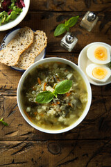 Traditional homemade green soup with hard boiled eggs