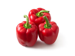 Ripe red bell peppers on a white background