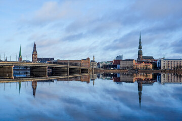 Beautiful panorama of Riga center over Daugava river with St Peters Church and Stone bridge in winter. Selective focus