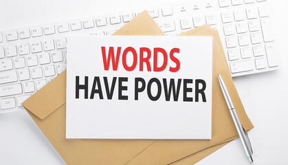 Text WORDS HAVE POWER on the envelope on the keyboard