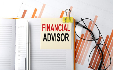 Text FINANCIAL ADVISOR on sticker on the notepad on diagram background