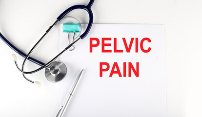 PELVIC PAIN text written on paper with a stethoscope. Medical concept.