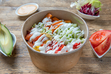 Fish poke bowl, with salmon and vegetables, 