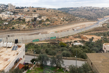 Fototapeta na wymiar View from the outskirts of Bethlehem to the security dividing fence between Israel and the Palestinian Authority in Bethlehem in the Palestinian Authority, Israel