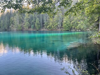 The Fusine lakes in Friuli Venezia Giulia Italy. Mountain lake, trees and lake, mountain and lake, lake and mountain panorama, blue water on the lake.
