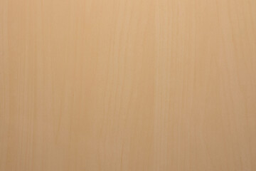 Wooden table with its shapes, light color and overhead view.