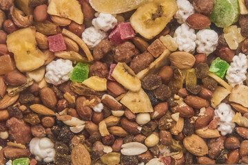 A background of healthy food. Organic snacks. Dried fruits and dried nuts background