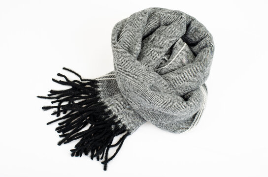 Warm stylish gray wool scarf on white background. Studio Photo