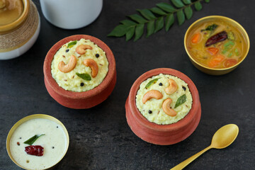 Ven Pongal Khara Pongal Sambar coconut chutney woman hand serving Indian breakfast food Tamil Nadu festival Pongal Sankranti Diwali spicy pongal using rice lentil semolina rava South India Sri Lanka