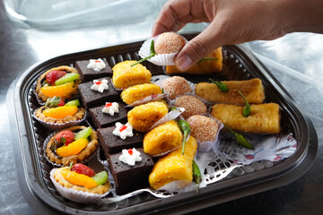 many traditional market snacks such as risoles, onde - onde, cakes and omelet rolls.